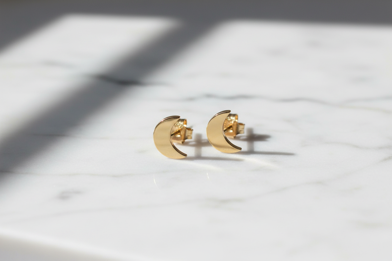 9kt Yellow Gold Moon Stud Earrings on Worktop